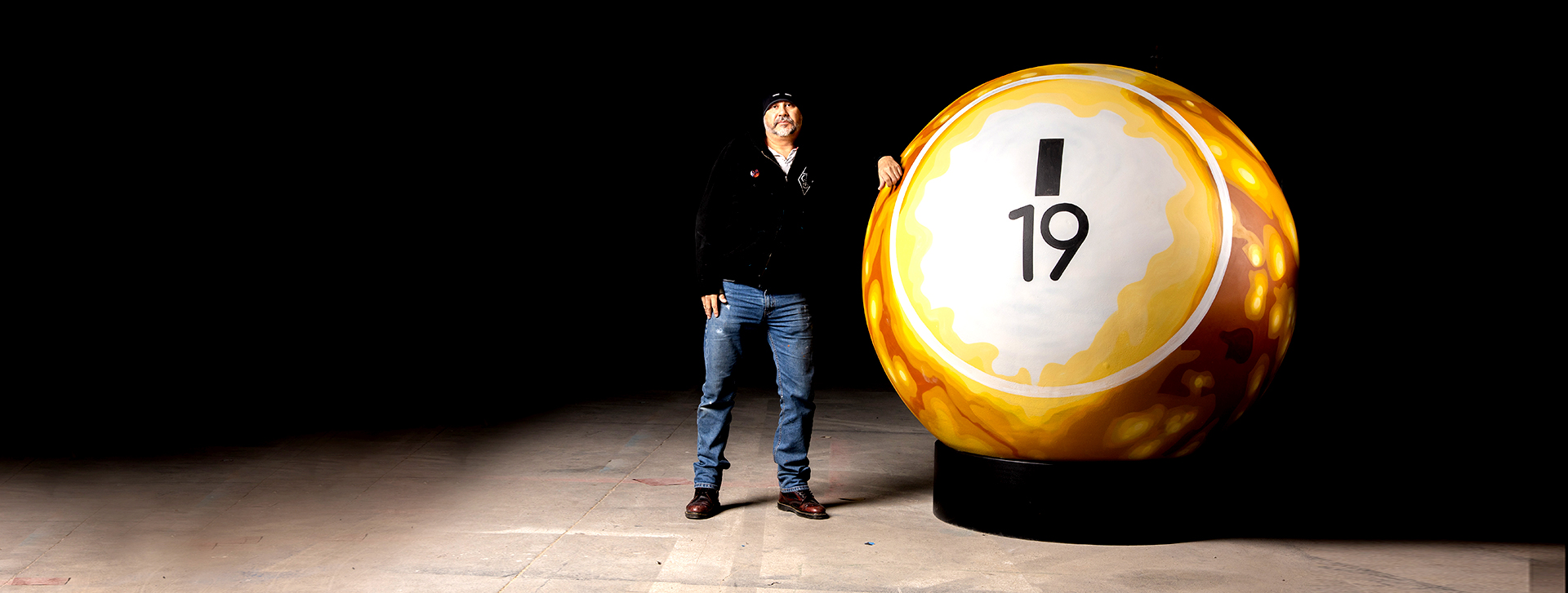 man with giant bingo ball